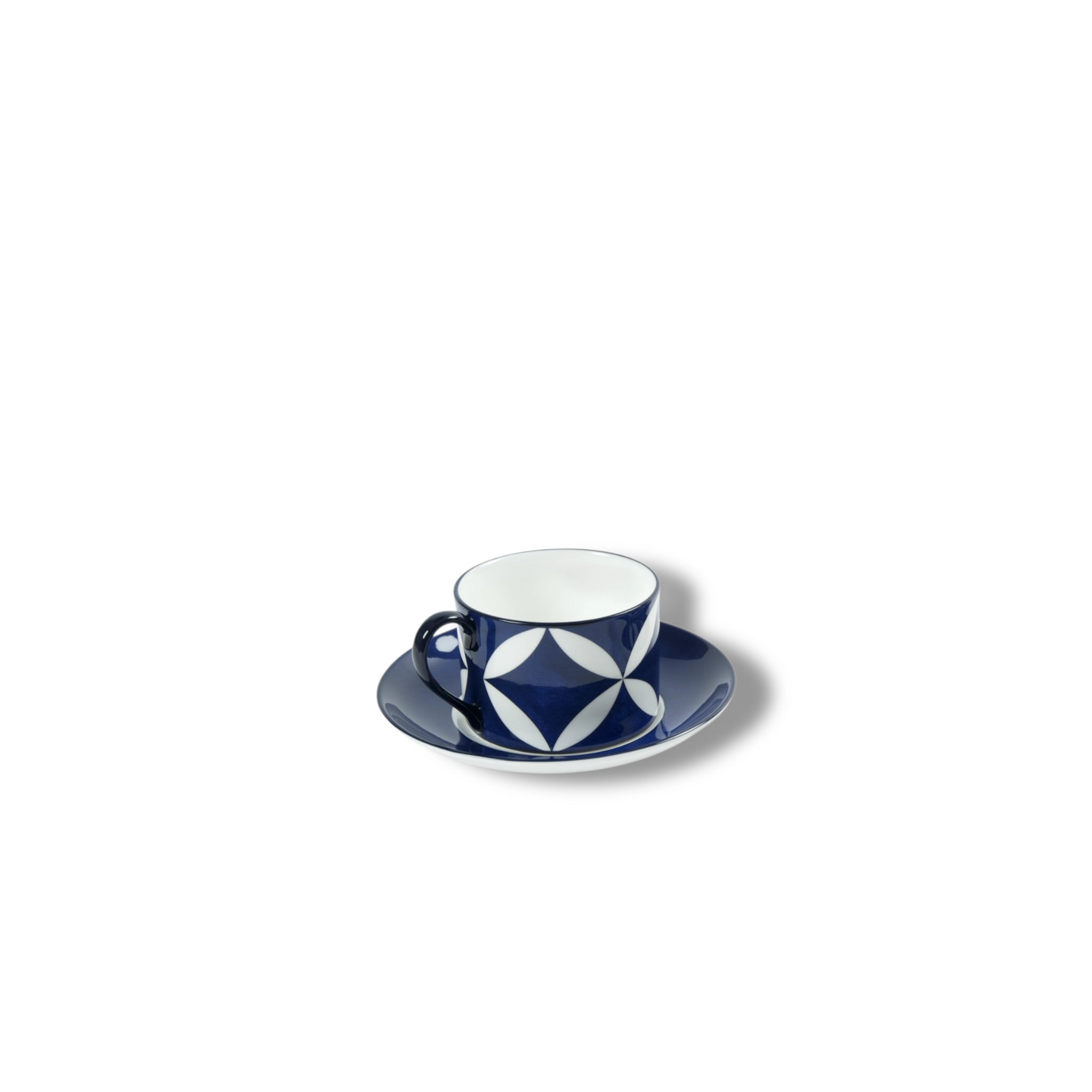 Lohr Astor Waldorf Star tea cup and saucer set with elegant white porcelain and gold accents, showcasing intricate star patterns.